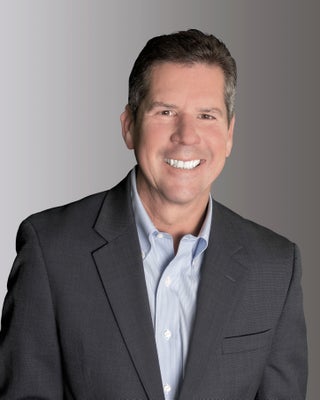 Portrait of Rory Hickok, Realtor